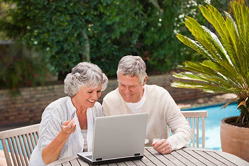SeniorNet Couple With laptop